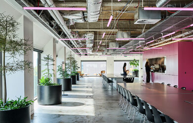 Hassell Studio 55 in Melbourne, a regenerative workplace featuring exposed services, reused materials and flexible workspaces